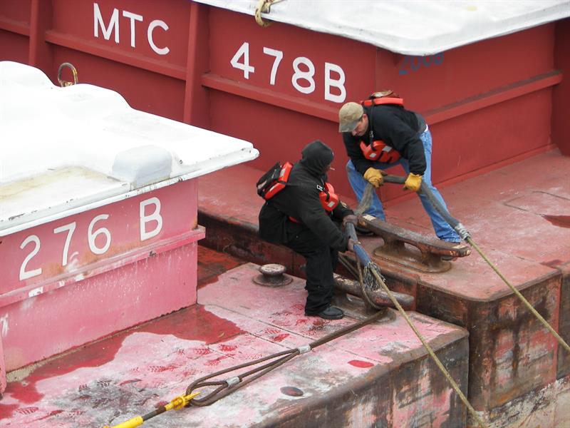 Deckhands working aboard a barge