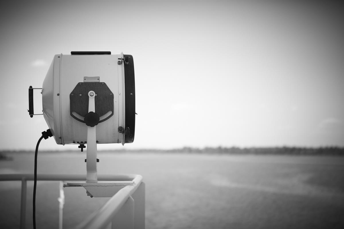 Spotlight attached to barge railing